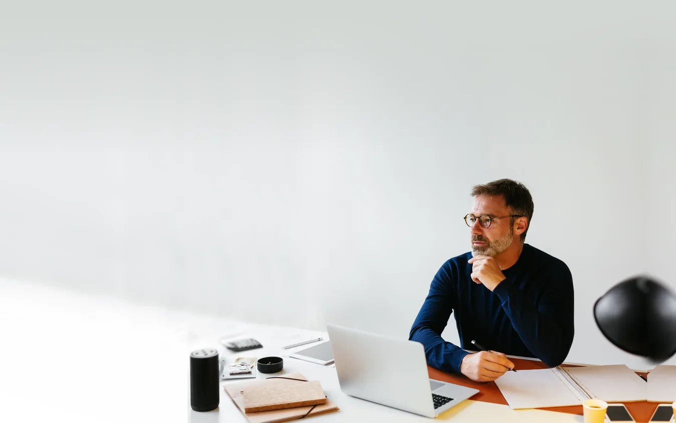 Man sitting at desk concentrating on work